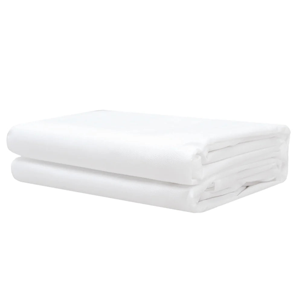 Close‑up of filter membrane and fabric on quilt protector, Folded white blanket on a white background
